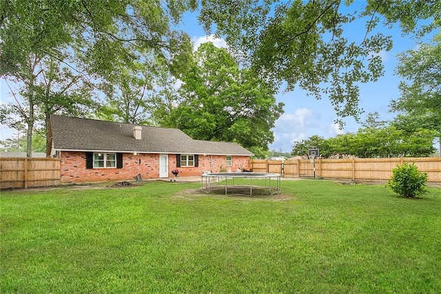 view of yard with a trampoline