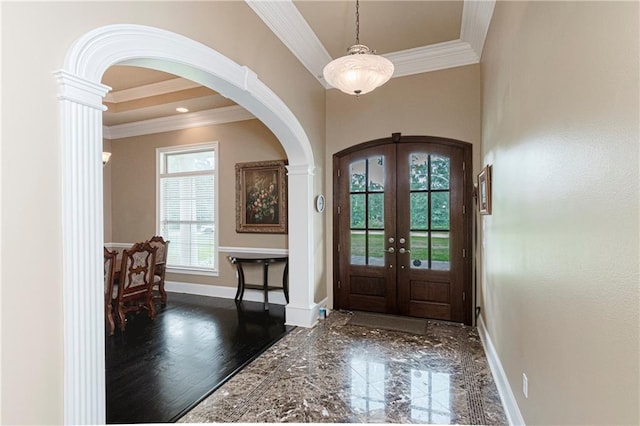 foyer entrance featuring french doors, ornamental molding, and dark wood-type flooring