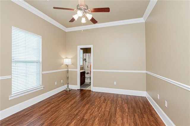 unfurnished room with ornamental molding, dark hardwood / wood-style flooring, and a healthy amount of sunlight