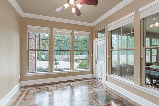 unfurnished sunroom with ceiling fan and a wealth of natural light