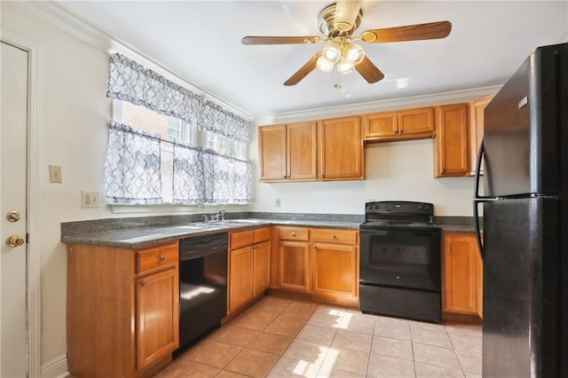 kitchen featuring light tile patterned floors, brown cabinetry, dark countertops, crown molding, and black appliances