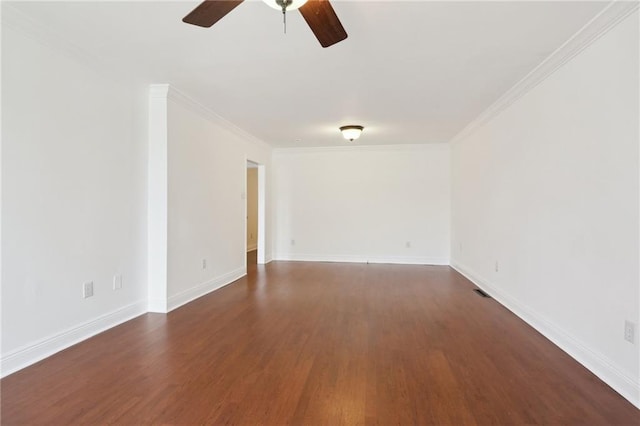 unfurnished room featuring baseboards, ornamental molding, ceiling fan, and dark wood-style flooring