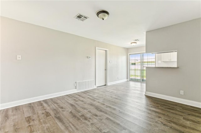 unfurnished room featuring wood-type flooring