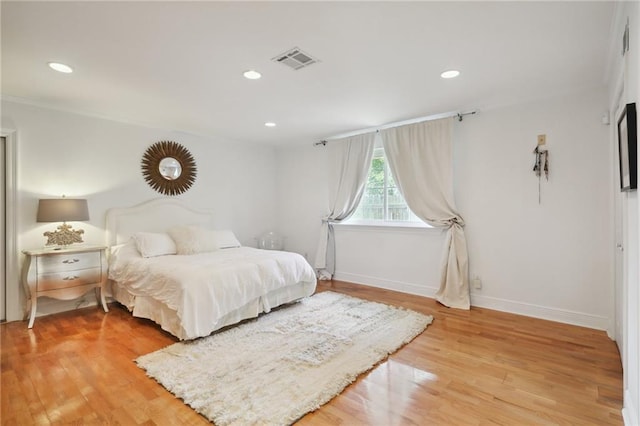 bedroom featuring wood-type flooring