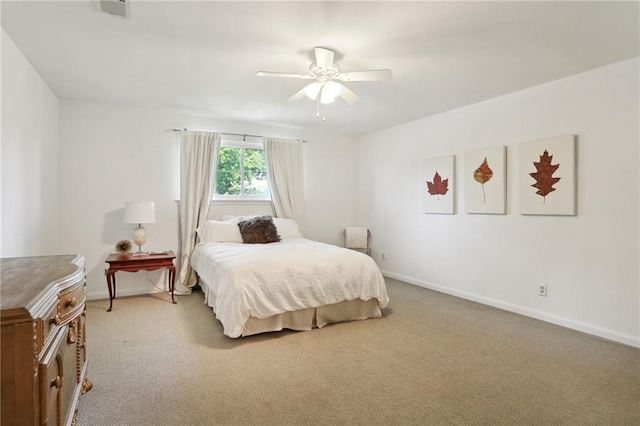 bedroom with light carpet and ceiling fan