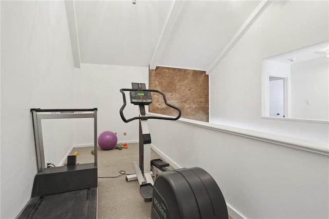 workout room with carpet flooring and lofted ceiling