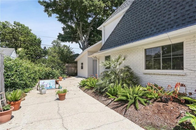 view of property exterior featuring a patio area