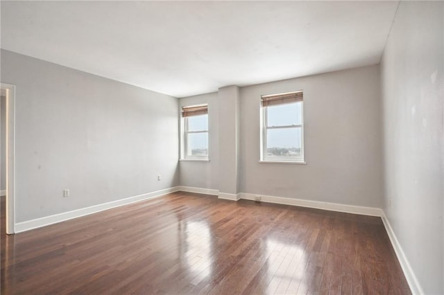 empty room featuring wood-type flooring