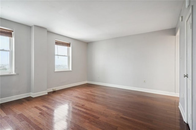 empty room featuring dark hardwood / wood-style floors