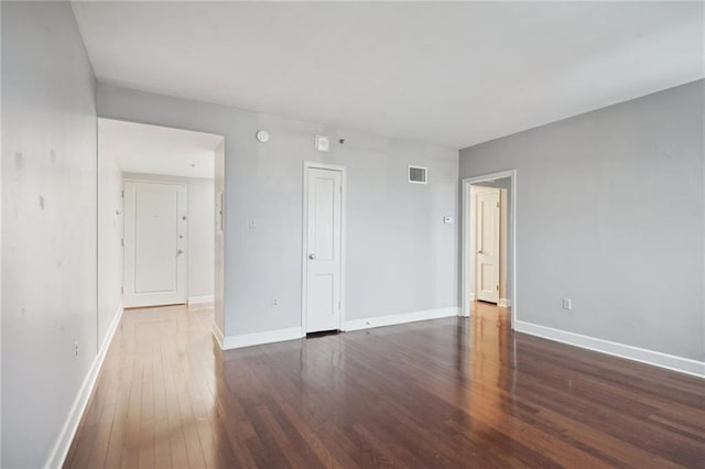 empty room with wood-type flooring