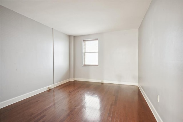 spare room with hardwood / wood-style flooring