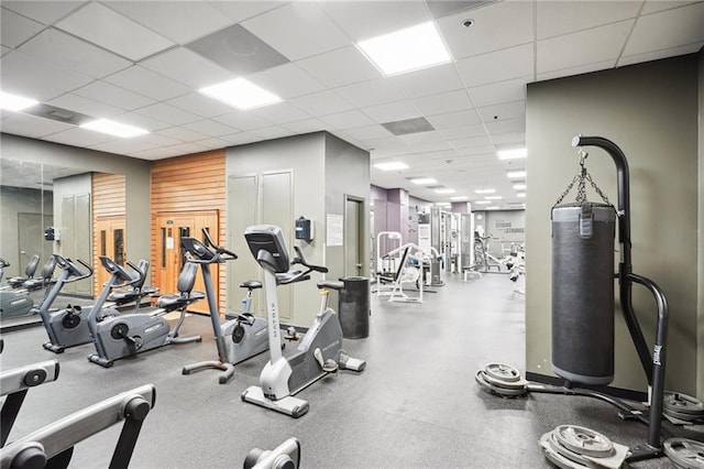 workout area with a drop ceiling