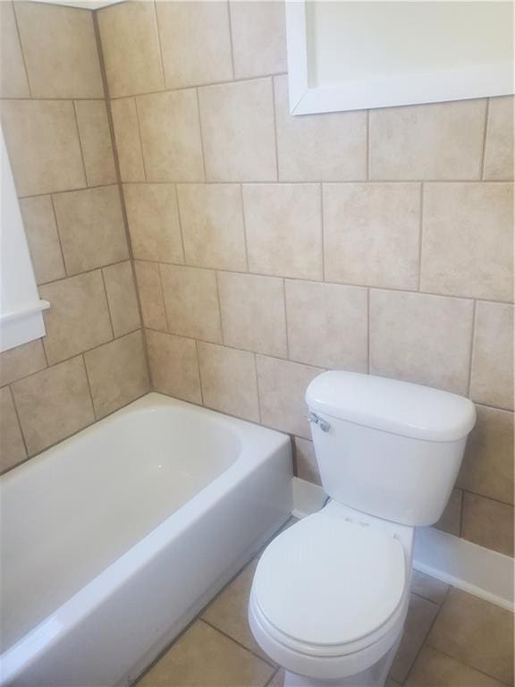 bathroom with tile patterned floors and toilet