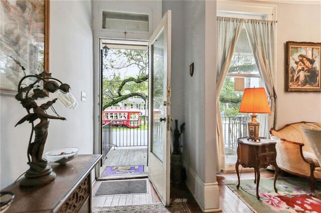 doorway with hardwood / wood-style floors