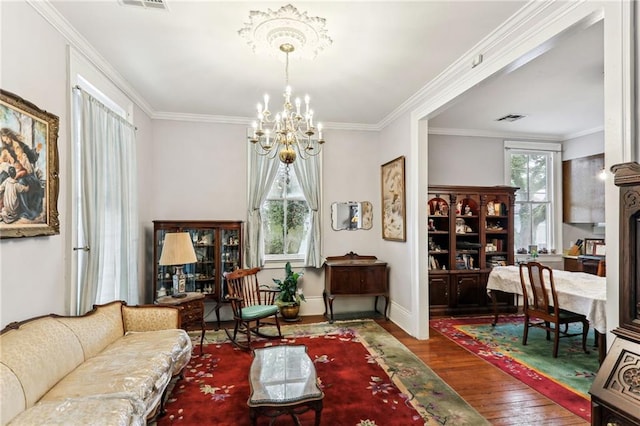 interior space featuring ornamental molding, dark wood-type flooring, and a chandelier