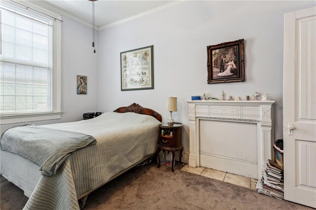 bedroom featuring ornamental molding, multiple windows, and light colored carpet