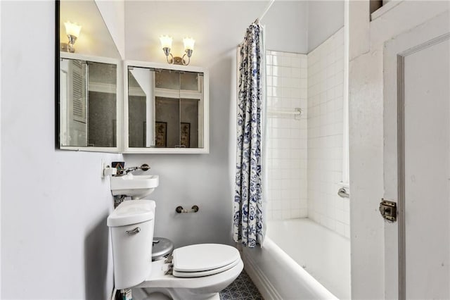 full bathroom with shower / bath combination with curtain, sink, and toilet