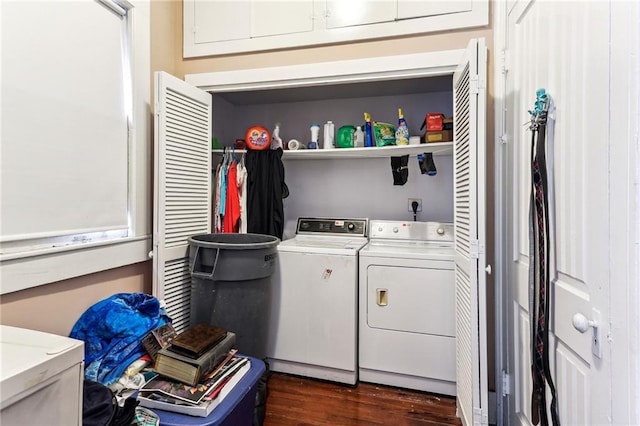 laundry area with dark wood-type flooring and independent washer and dryer