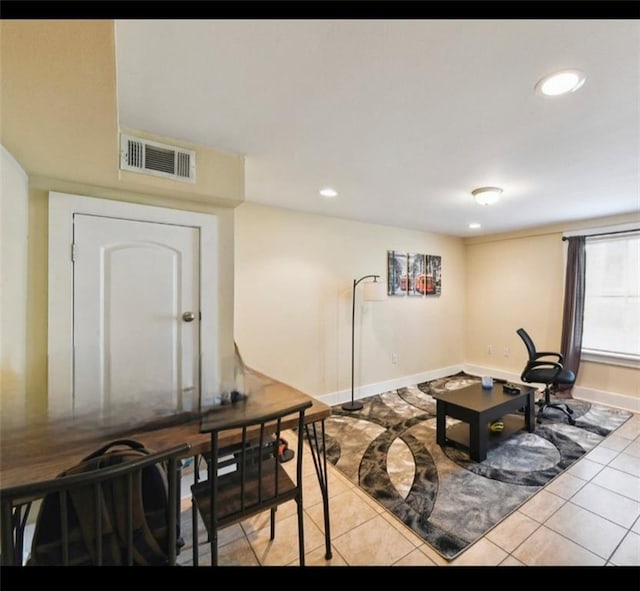 living room featuring light tile patterned flooring