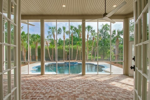 view of swimming pool featuring ceiling fan and a patio area