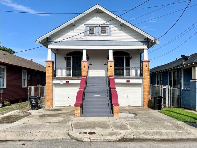 view of front facade featuring a porch and a garage