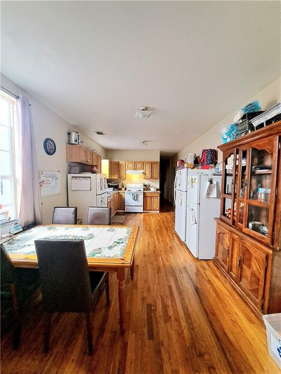 dining area with light wood-type flooring