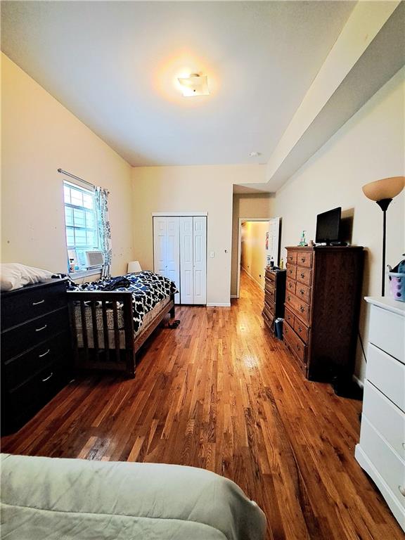 bedroom with hardwood / wood-style flooring