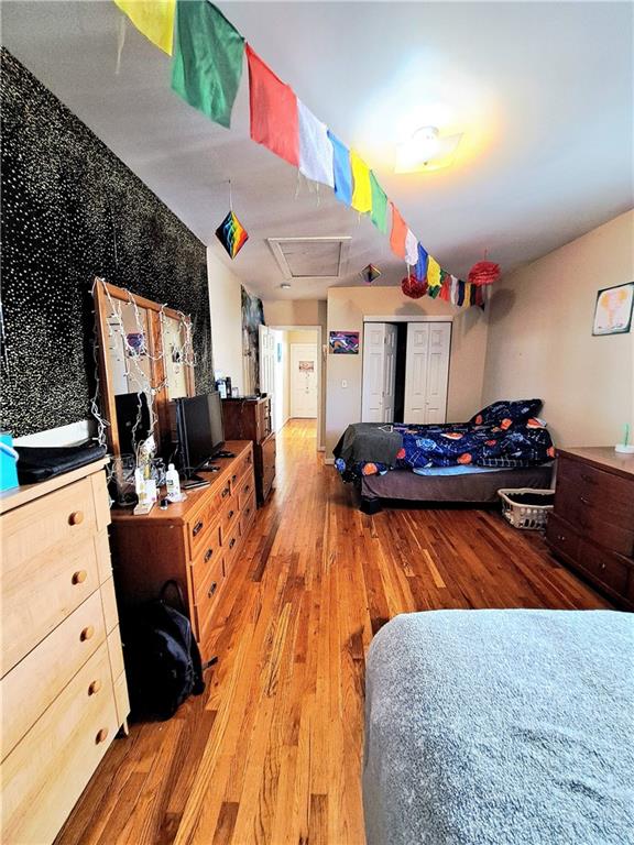 bedroom featuring wood-type flooring