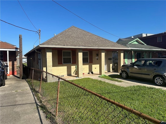 bungalow with a front yard