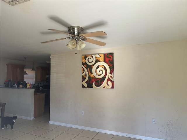 interior space featuring ceiling fan and light tile floors