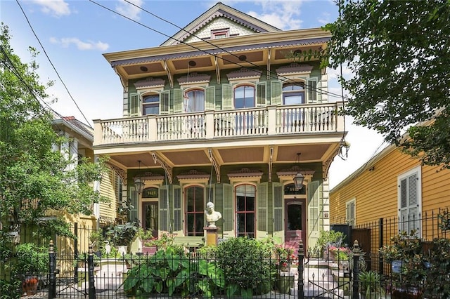 view of front of home with a porch and a balcony