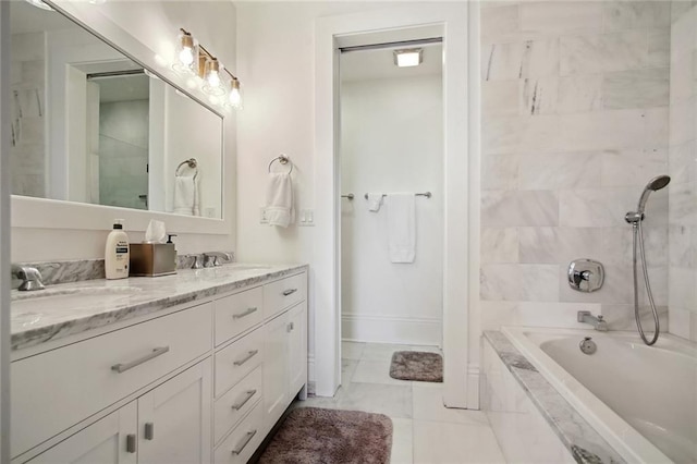 bathroom with vanity and tiled shower / bath combo