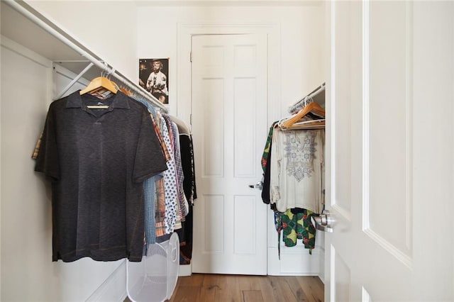 spacious closet featuring hardwood / wood-style floors