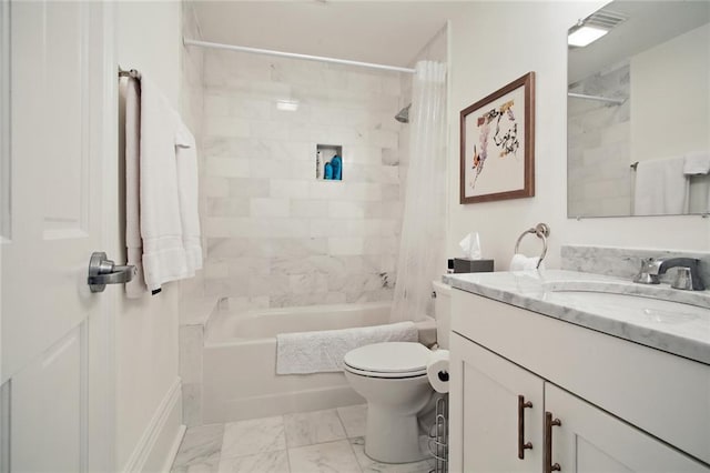 full bathroom with vanity, toilet, and tiled shower / bath combo