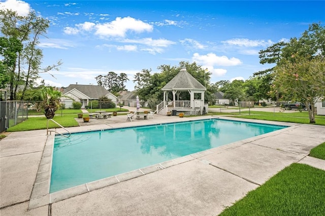 view of pool with a patio, a gazebo, and a lawn