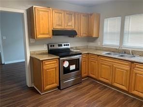 kitchen featuring stainless steel range with electric stovetop, dark hardwood / wood-style floors, sink, and range hood