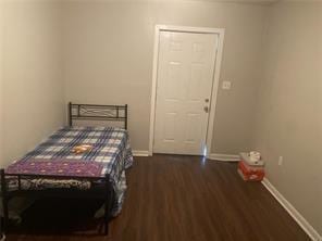 bedroom featuring dark hardwood / wood-style flooring