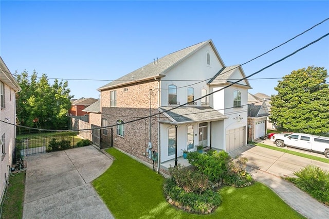 view of side of property with a lawn and a garage