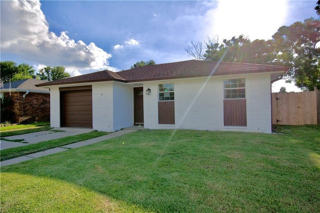 single story home with a front lawn and a garage