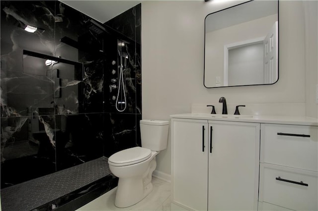 bathroom featuring walk in shower, vanity, and toilet