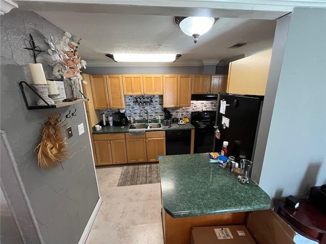 kitchen featuring backsplash, sink, crown molding, and black appliances