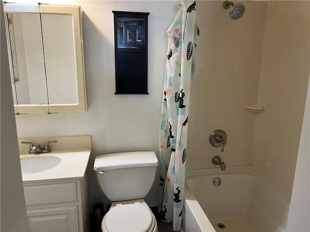 full bathroom featuring vanity, toilet, and shower / tub combo