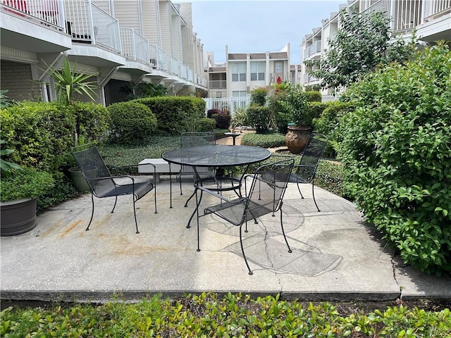 view of patio featuring a balcony