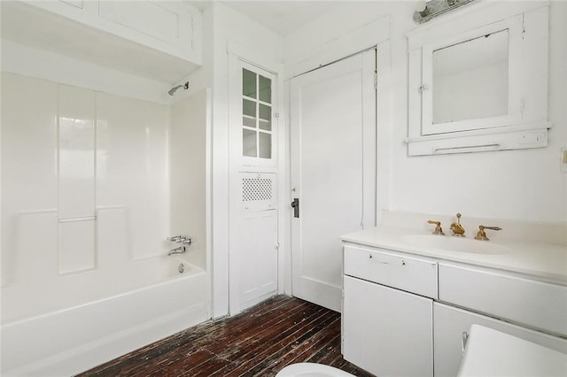 bathroom with vanity, tub / shower combination, and hardwood / wood-style floors