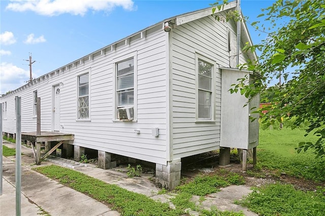 view of home's exterior with cooling unit