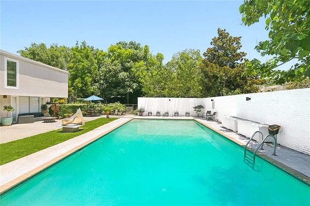 view of swimming pool featuring a patio area