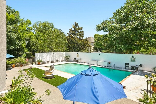 view of pool featuring a patio