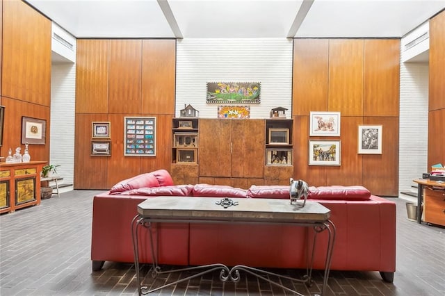 living room featuring wood walls