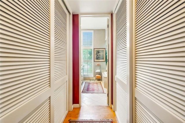 corridor featuring hardwood / wood-style floors