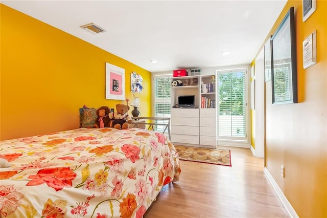 bedroom featuring light wood-type flooring